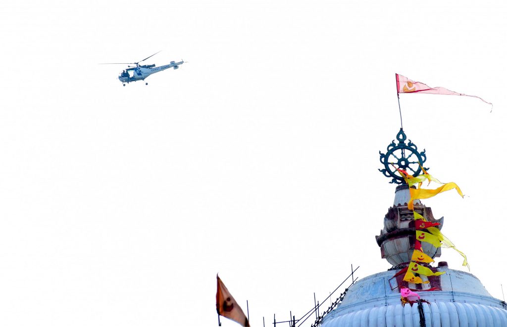 A chopper flies over Puri Srimandir Friday even as preparations progress around the temple.