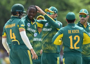 South Africa’s Kagiso Rabada (2nd from L) is mobbed by teammates after dismissing a Sri Lankan batsman at Dambulla, Sunday