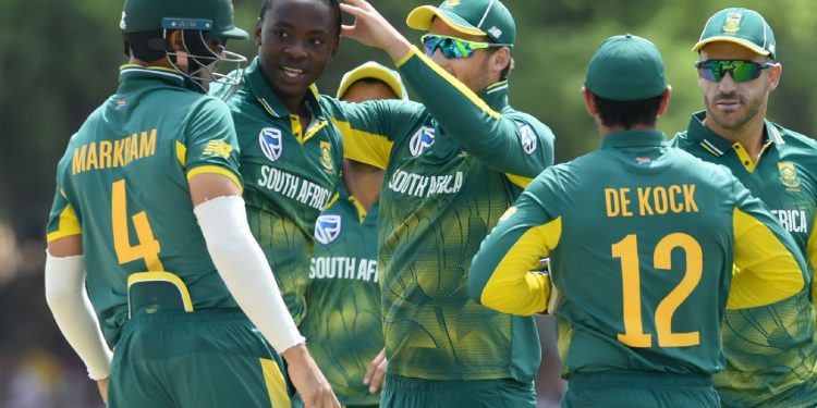 South Africa’s Kagiso Rabada (2nd from L) is mobbed by teammates after dismissing a Sri Lankan batsman at Dambulla, Sunday