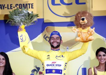 Stage winner and new overall leader Fernando Gaviria of Colombia celebrates on the podium after the first stage of the Tour de France cycling race over in Fontenay Le-Comte, France, Saturday