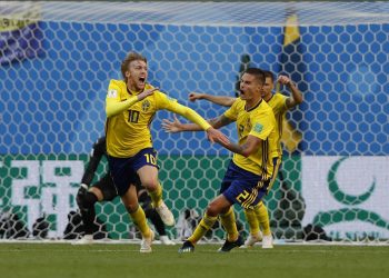 Sweden's Emil Forsberg (L) celebrates with teammates after scoring the winner against Switzerland at the St. Petersburg Stadium