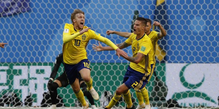 Sweden's Emil Forsberg (L) celebrates with teammates after scoring the winner against Switzerland at the St. Petersburg Stadium