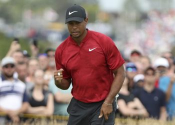 Tiger Woods of the US after a birdie putt on the 4th hole during the final round of the British Open Golf Championship in Carnoustie