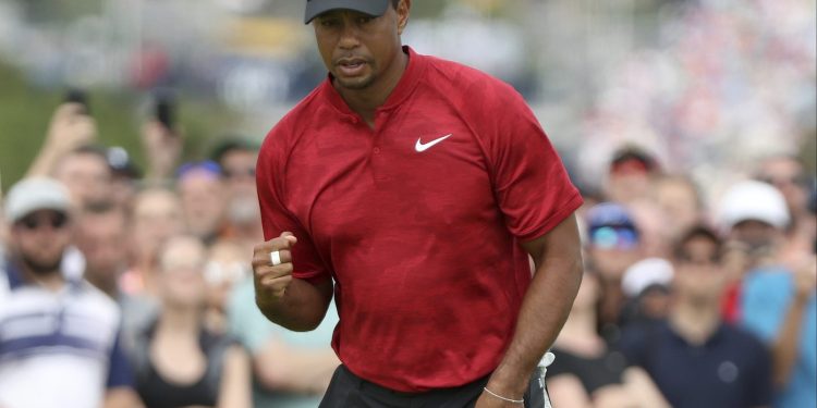 Tiger Woods of the US after a birdie putt on the 4th hole during the final round of the British Open Golf Championship in Carnoustie