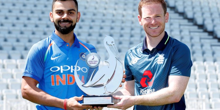 Indian captain Virat Kohli(L) and England skipper Eoin Morgan pose with the ODI trophy, Wednesday