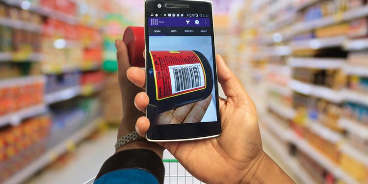 Supermarket interior with shopping cart