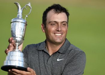 Francesco Molinari poses with the Claret Jug after his title triumph, Sunday