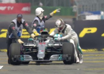 Lewis Hamilton pushes his car out of German qualifying