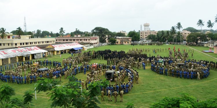 Police personnel conduct a mock drill for the upcoming Rath Yatra, at Reserve Police ground in Puri, Thursday.