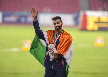 Arpinder Singh pose with the gold medal at Jakarta, Wednesday
