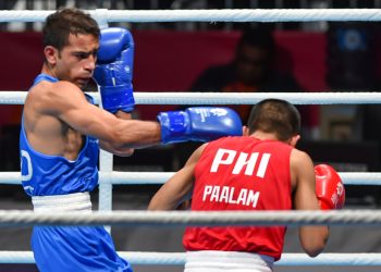 India’s Amit Phangal lands a punch during his bout against Philippines’ Carlo Paalam, Friday