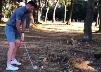 The shot that went awry: Jimmy Anderson about to hit the ball in Buckinghamshire, Sunday