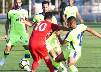 Bengaluru FC and Atletico Saguntino players tussle for the ball during their match, Friday