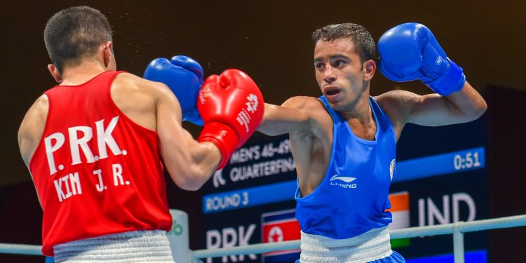 Amit Panghal (Blue) and Ryong Jong in action during their quarterfinal bout in Jakarta, Wednesday