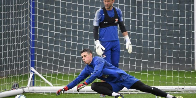 Custodian Kepa Arrizabalaga dives to his right for a save during Chelsea’s training session, Thursday