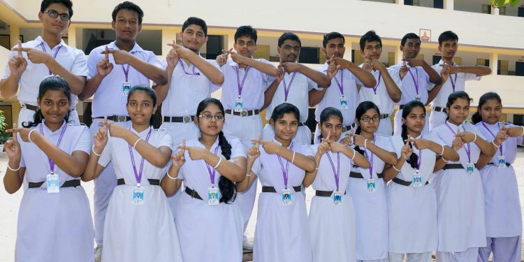 Students of Tulasipur Saraswati Sishu Vidyamandir in Cuttack support plastic-free drive, Friday.