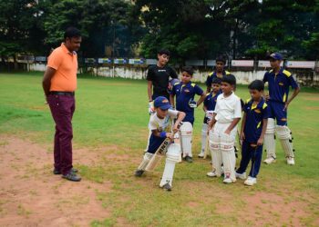 Debashis Mohanty gives pep talk to budding cricketers at Saheed Sporting Ground in Bhubaneswar, Saturday  