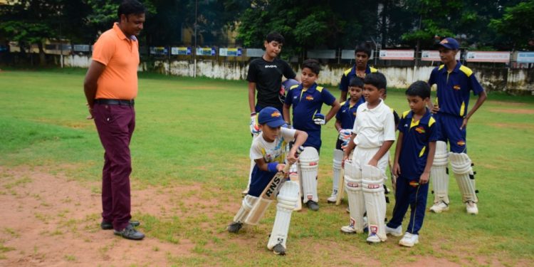 Debashis Mohanty gives pep talk to budding cricketers at Saheed Sporting Ground in Bhubaneswar, Saturday  
