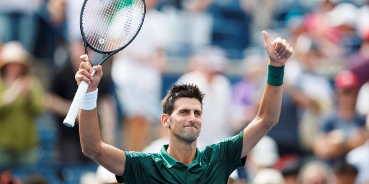 Novak Djokovic acknowledges the applause of the crowd after his win Tuesday over Mirza Basic at Montreal