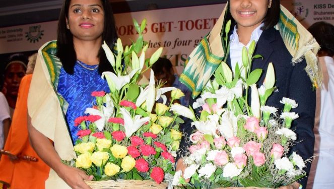 Dutee Chand (L) and Rutuparna Panda pose for a photograph after being felicitated in Bhubaneswar, Sunday  