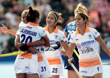 Lalremsiami (C) celebrates with teammate Lilima Minz after scoring India’s first goal against Italy, Tuesday
