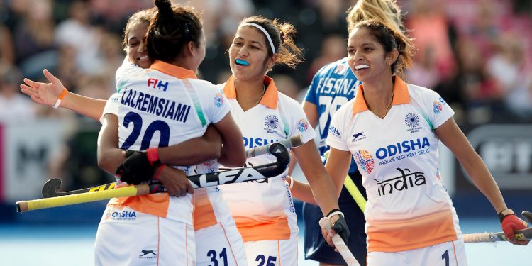 Lalremsiami (C) celebrates with teammate Lilima Minz after scoring India’s first goal against Italy, Tuesday