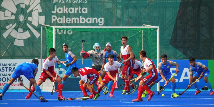India and Hong Kong China players in action during the  men's hockey pool match at the Asian Games in Jakarta