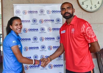 Skipper of the Indian women’s hockey team Rani wishes luck to his men’s team counterpart before the departure of the teams for the Asian Games in Indonesia  