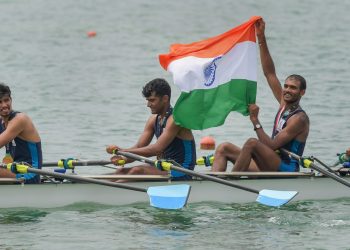 Rowers Sawarn Singh, Dattu Baban Bhokanal, Om Prakash and Sukhmeet Singh pose with after winning gold, Friday