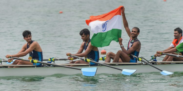 Rowers Sawarn Singh, Dattu Baban Bhokanal, Om Prakash and Sukhmeet Singh pose with after winning gold, Friday