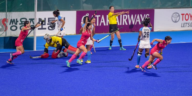 Japanese players celebrate after scoring a goal against India in the women's hockey final match at the Asian Games