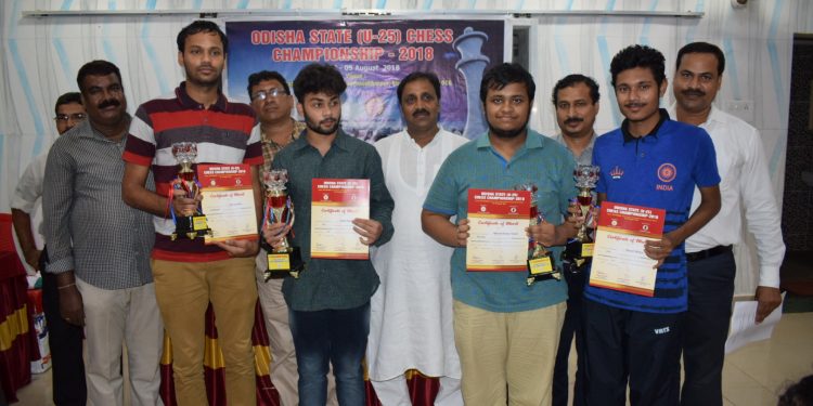 Winners of Odisha State U-25 Chess Championship pose with their trophies and certificates along with guests in Bhubaneswar, Sunday  