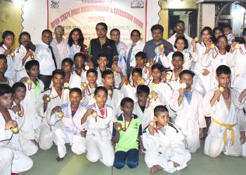 Winners of State Open Judo Championships pose with their medals along with guests in Bhubaneswar, Sunday    