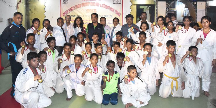 Winners of State Open Judo Championships pose with their medals along with guests in Bhubaneswar, Sunday    