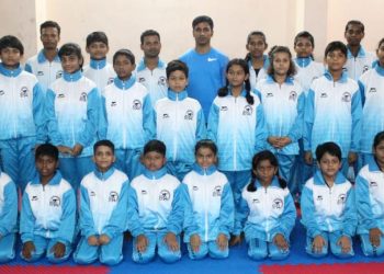 Berhampur taekwondo players pose for a photograph Thursday before their departure to Cuttack   