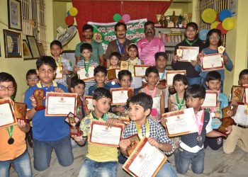 Prize winners of the various categories in the invitational chess tournament pose with their trophies and certificates along with officials at Cuttack, Thursday      