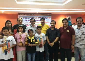 Winners in various categories of All Odisha U-9 chess Championship pose with their winners’ trophies along with guests in Dhenkanal, Sunday    