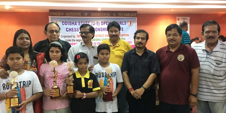 Winners in various categories of All Odisha U-9 chess Championship pose with their winners’ trophies along with guests in Dhenkanal, Sunday    