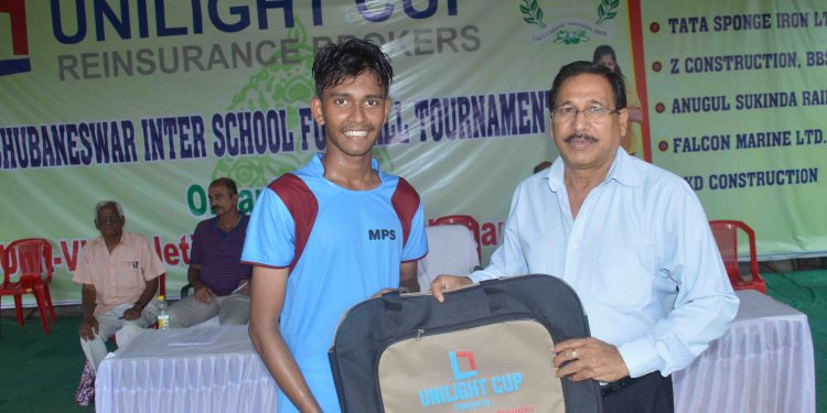 Sohan Dandapata of MPS receives the man of the match award from UAA vice-president Akshay Kumar Das in Bhubaneswar, Monday