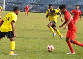 Radha Raman Club (in yellow) and Sports Hostel players in action during their match at Cuttack, Wednesday