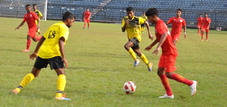 Radha Raman Club (in yellow) and Sports Hostel players in action during their match at Cuttack, Wednesday