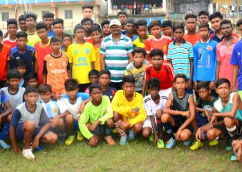 Footballers pose for a photograph along with officials during the two-day selection camp in Sambalpur, Saturday                 