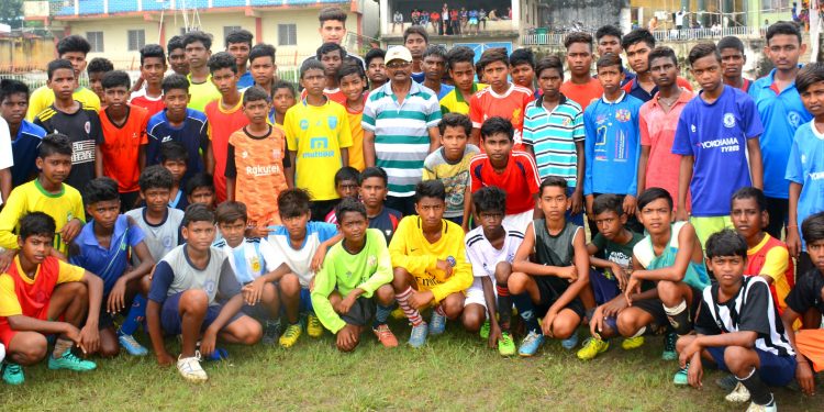 Footballers pose for a photograph along with officials during the two-day selection camp in Sambalpur, Saturday                 