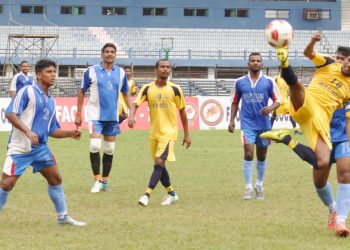 OGP and Chauliaganj Club players tussle for the ball during their match at the Barabati Stadium in Cuttack, Tuesday