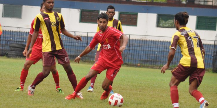 A Mangala Club player (in red) tries to get past Rovers Club defenders during their match at Barabati Stadium in Cuttack, Thursday    
