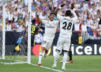 Marco Asensio (20) joins teammate Vinicius Jr for celebration after scoring Real Madrid’s second goal against Juventus, Saturday