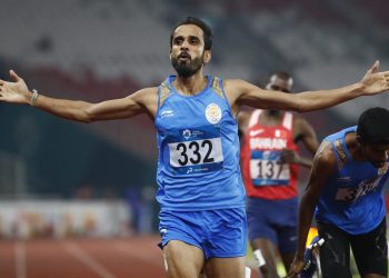 India's Manjit Singh celebrates as he crosses the finish line to win the men's 800m final at the Asian Games in Jakarta