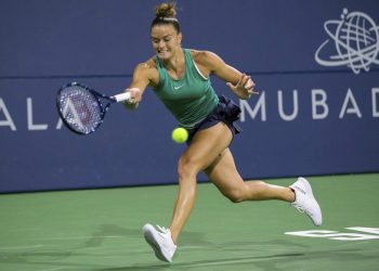 Caption

Maria Sakkari returns a shot to Danielle Collins during their semifinal match at San Jose, Saturday   