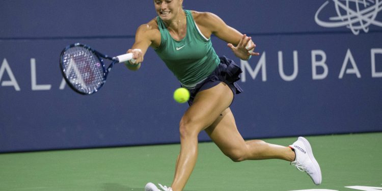 Caption

Maria Sakkari returns a shot to Danielle Collins during their semifinal match at San Jose, Saturday   