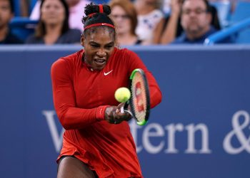 Serena Williams returns a shot against Daria Gavrilova in the Cincinnati Open tennis tournament